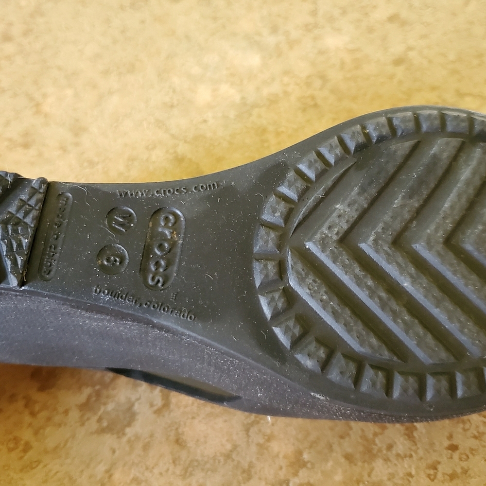 Crocs.  wedge healed.  Flat black sandals